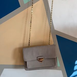 Grey purse with gold metal